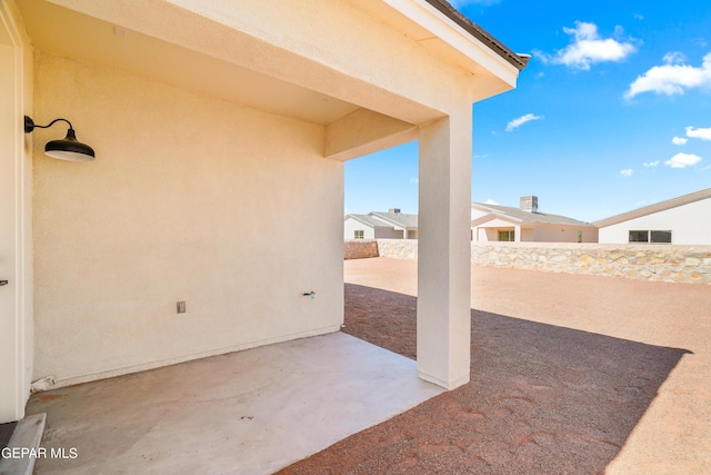 view of patio featuring fence