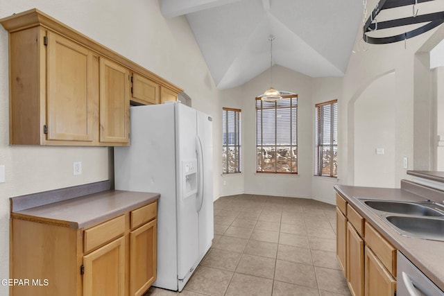 kitchen with sink, light tile patterned floors, white fridge with ice dispenser, decorative light fixtures, and dishwasher