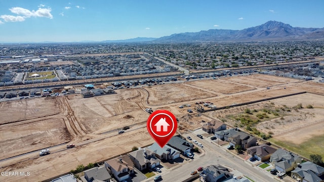 drone / aerial view featuring a mountain view