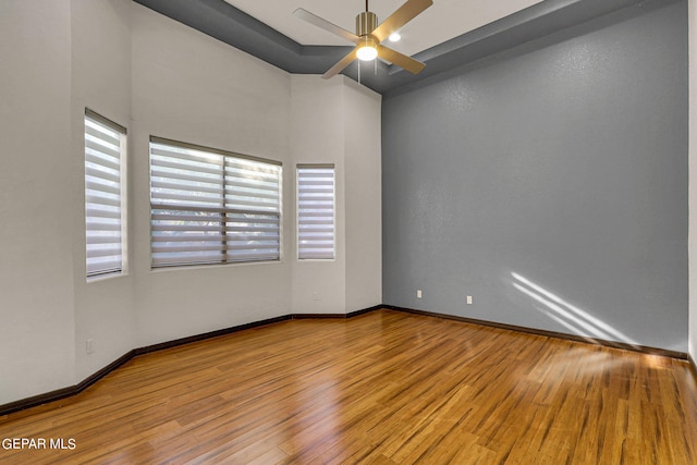 unfurnished room with ceiling fan and light wood-type flooring