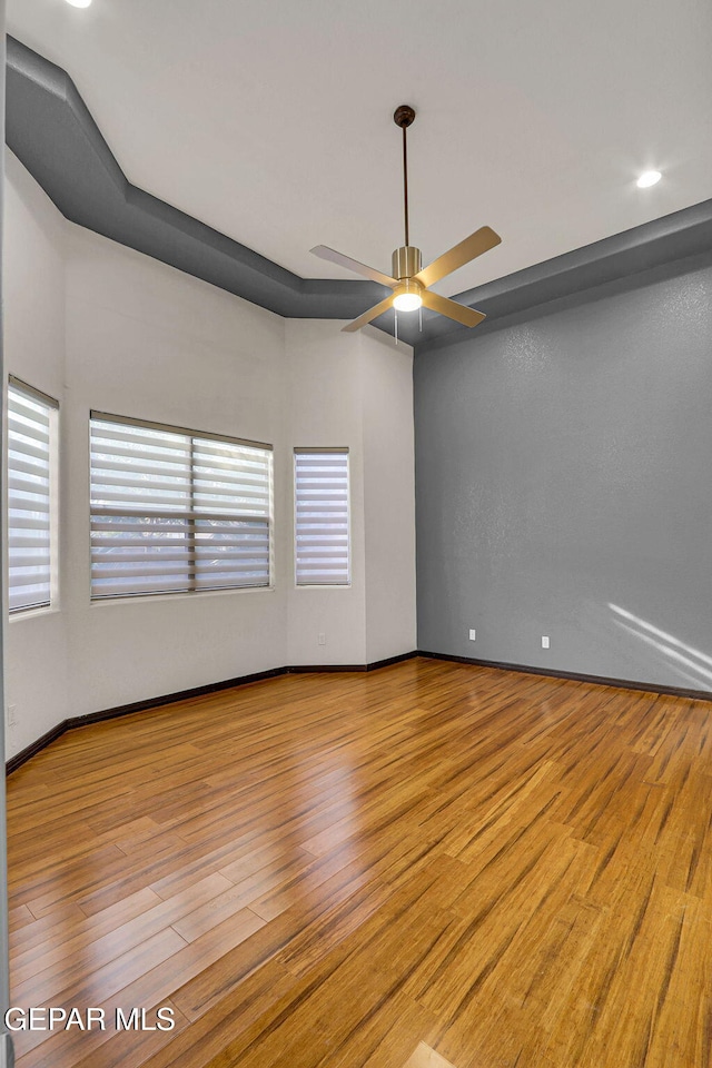 unfurnished room with light hardwood / wood-style floors and ceiling fan