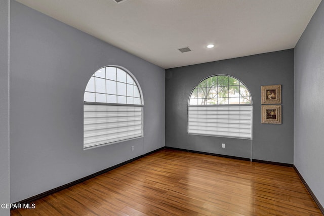 empty room with light hardwood / wood-style floors