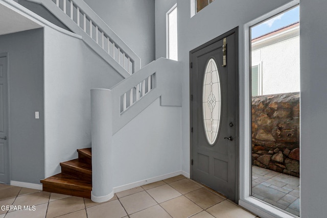 entrance foyer featuring light tile patterned flooring