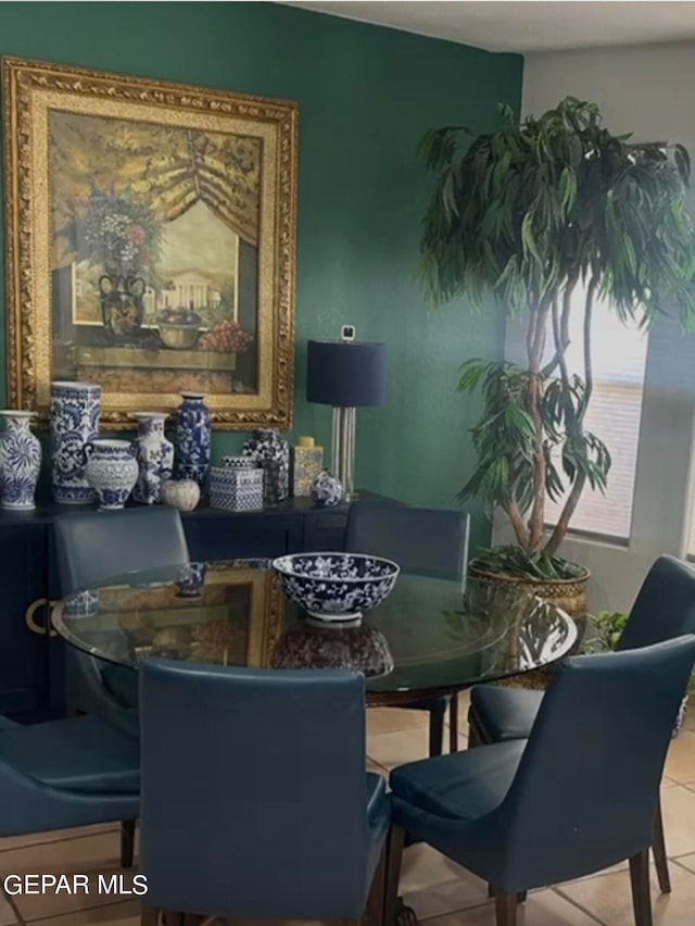 dining space featuring tile patterned floors