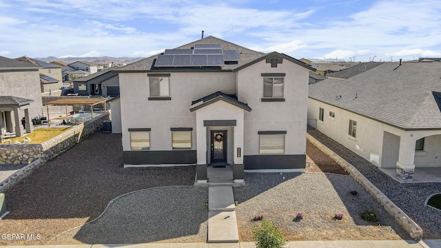 view of front of home with solar panels