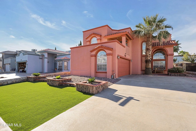 mediterranean / spanish-style home featuring a front lawn