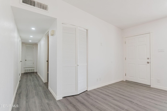 corridor featuring light wood-type flooring