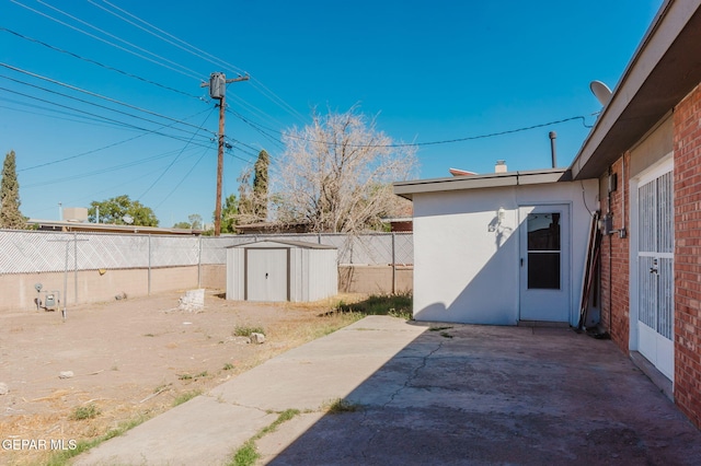 view of patio / terrace with a storage shed