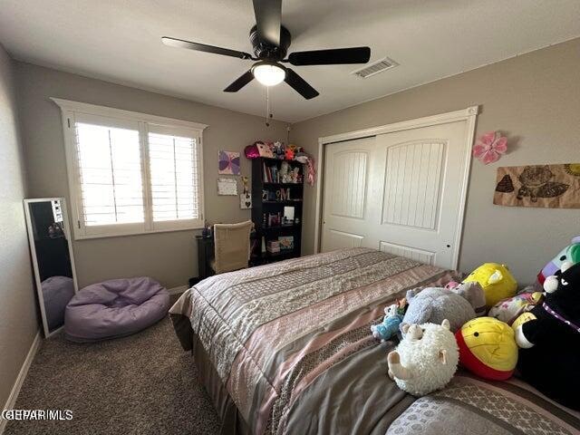 bedroom with carpet floors, a closet, and ceiling fan