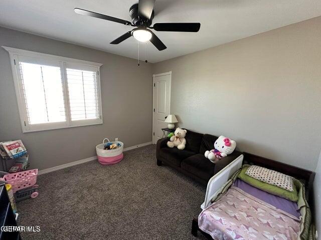 12419 Winners Cir, El Paso, TX 79928 - carpeted bedroom with baseboards and ceiling fan
