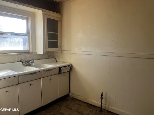 kitchen featuring white cabinetry