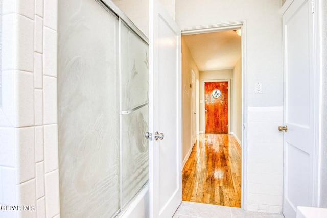 corridor featuring hardwood / wood-style floors