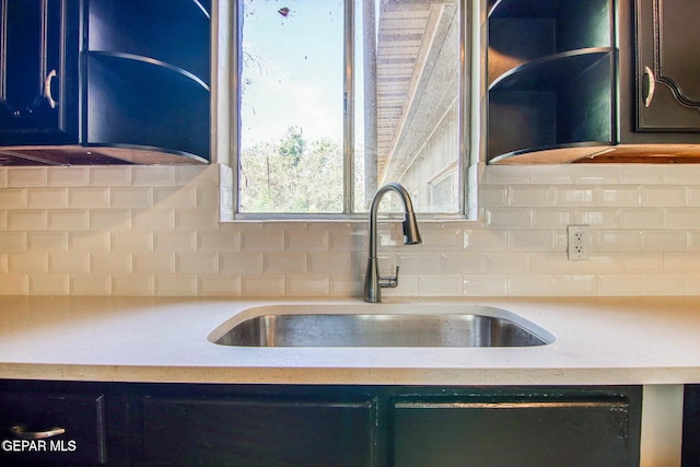 kitchen with backsplash and sink