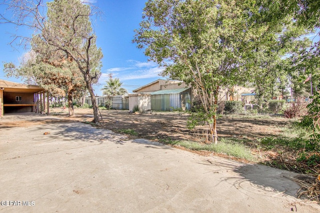 view of front of property featuring a carport