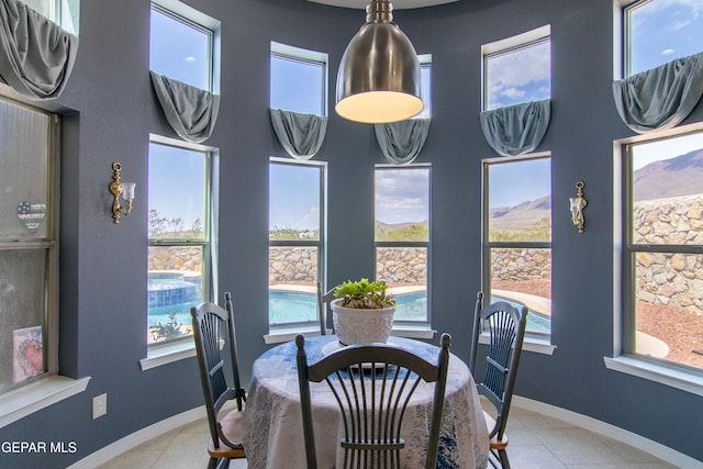 dining space with light tile patterned floors and a wealth of natural light