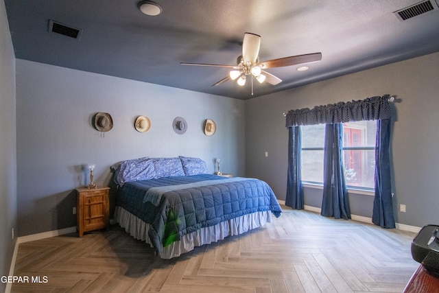 bedroom with light parquet floors and ceiling fan