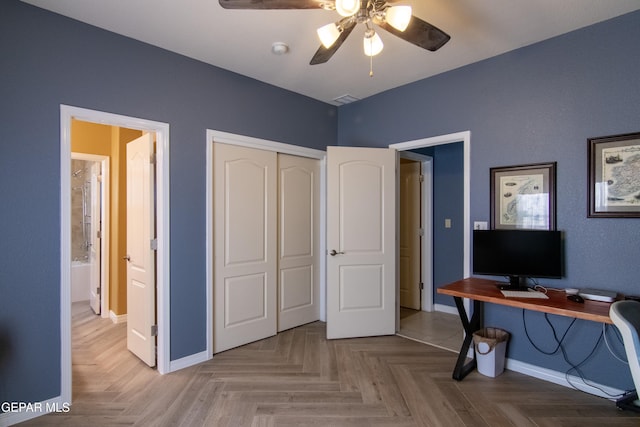 office area with parquet flooring and ceiling fan