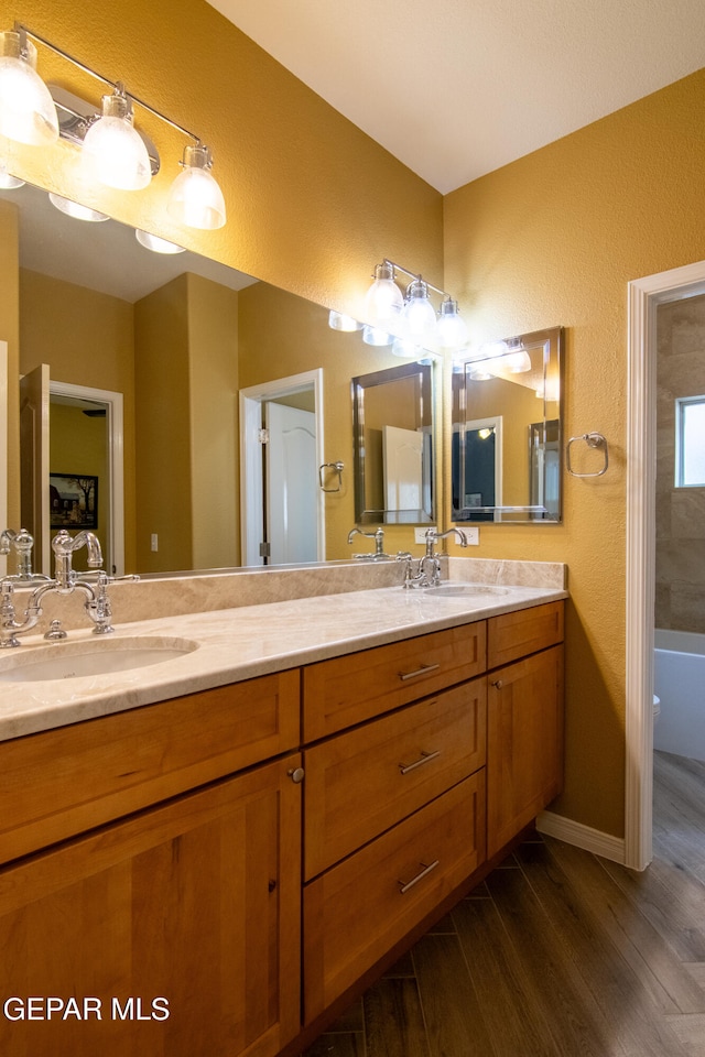 bathroom featuring vanity and hardwood / wood-style floors