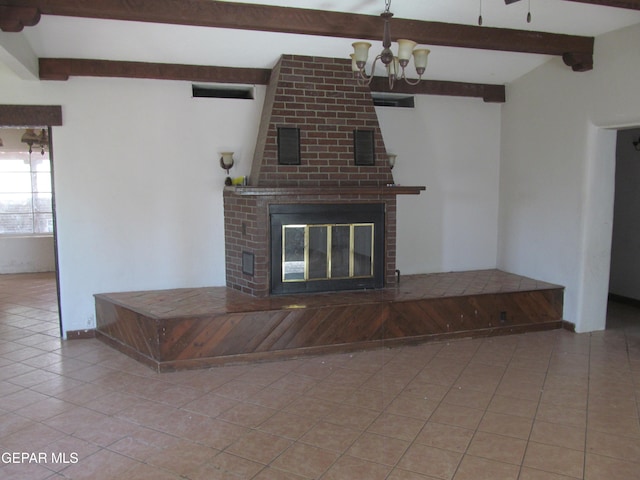 unfurnished living room with a brick fireplace, beam ceiling, a notable chandelier, and light tile patterned floors