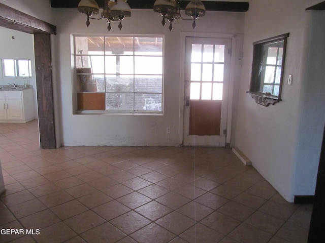 interior space featuring sink and light tile patterned flooring