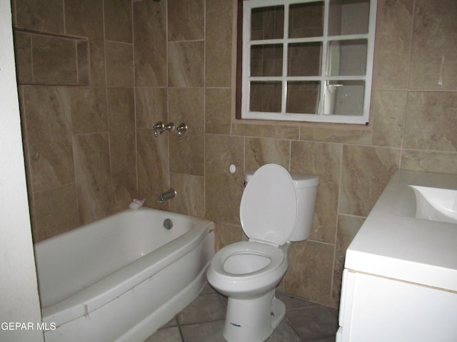 full bathroom featuring vanity, toilet, tile walls, and tile patterned flooring