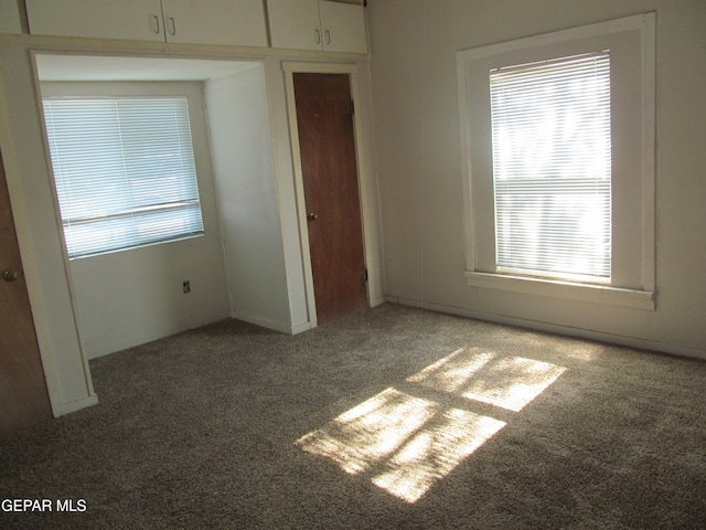 unfurnished bedroom with a closet and carpet