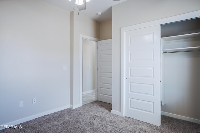 unfurnished bedroom featuring a closet, carpet, and ceiling fan