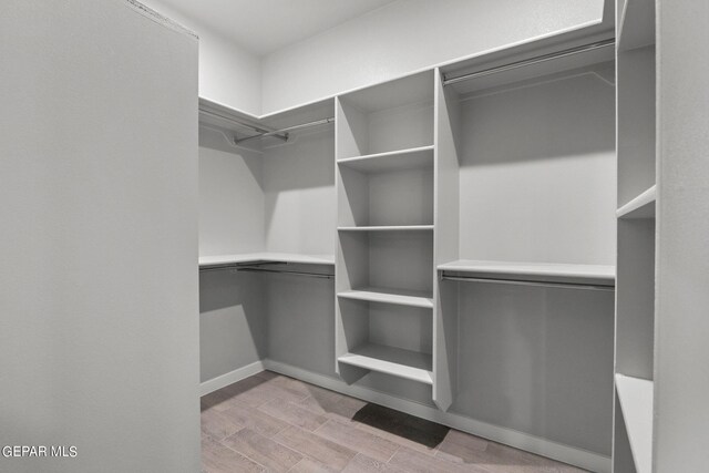 walk in closet featuring light wood-type flooring