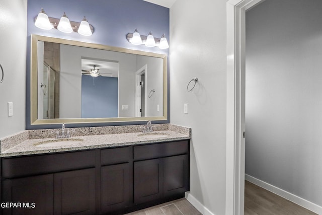 bathroom with vanity, an enclosed shower, hardwood / wood-style flooring, and ceiling fan