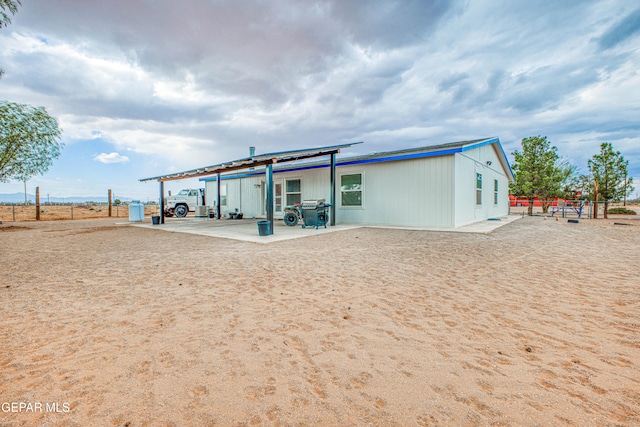 rear view of property featuring a patio