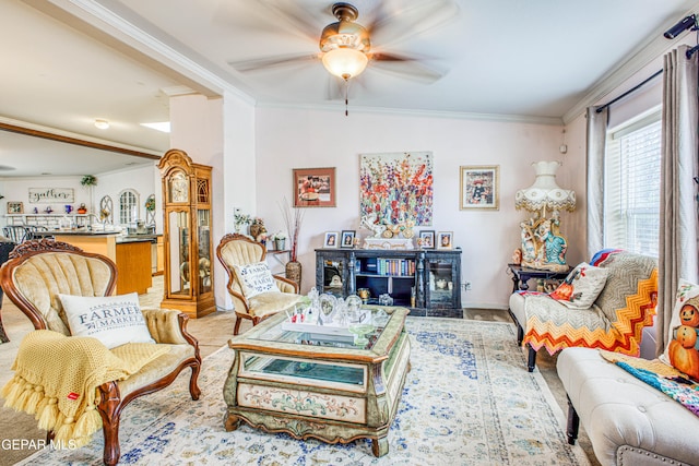 living room featuring ceiling fan and ornamental molding