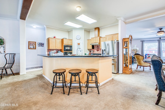 kitchen with light carpet, black microwave, backsplash, ornamental molding, and stainless steel fridge