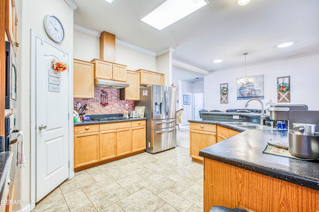 kitchen featuring stainless steel appliances, sink, crown molding, decorative light fixtures, and tasteful backsplash