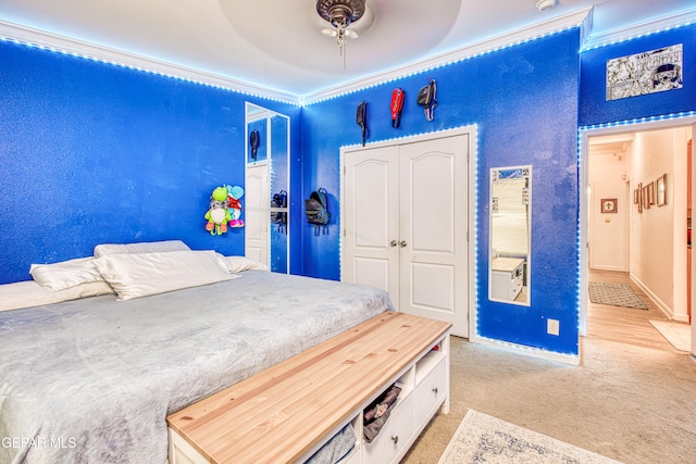 carpeted bedroom with a closet and ceiling fan