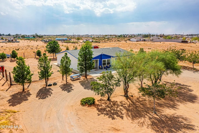 birds eye view of property featuring a rural view