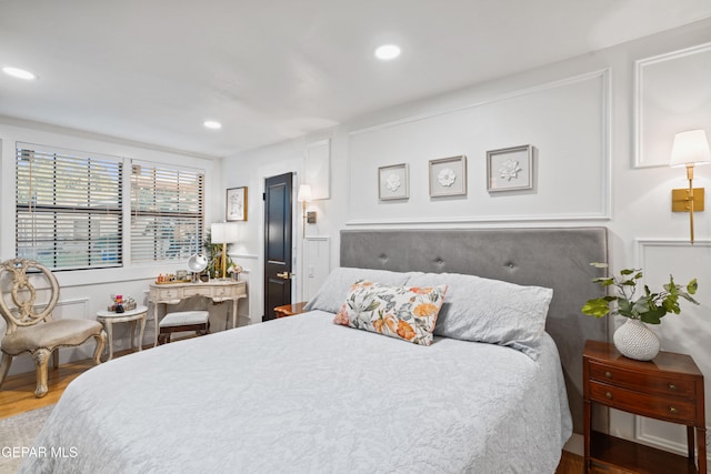 bedroom featuring hardwood / wood-style floors