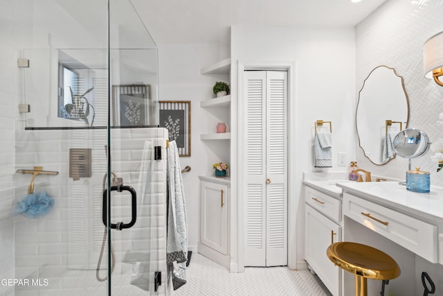 bathroom featuring vanity, walk in shower, and tile patterned flooring