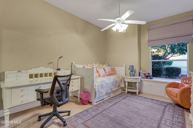 bedroom featuring light tile patterned floors and ceiling fan