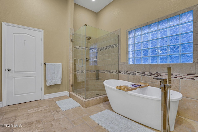 bathroom with shower with separate bathtub