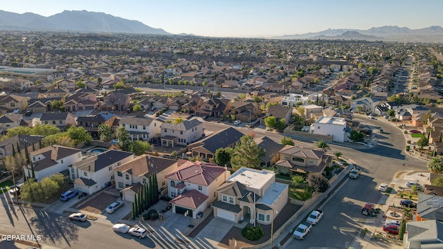 birds eye view of property featuring a mountain view