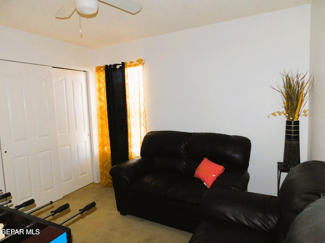 living room featuring ceiling fan and light carpet