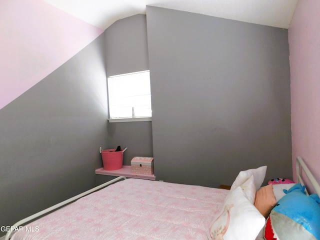 bedroom featuring vaulted ceiling