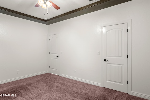 unfurnished room featuring ceiling fan and carpet flooring