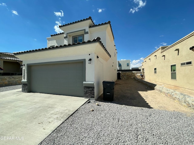 view of property exterior with a garage