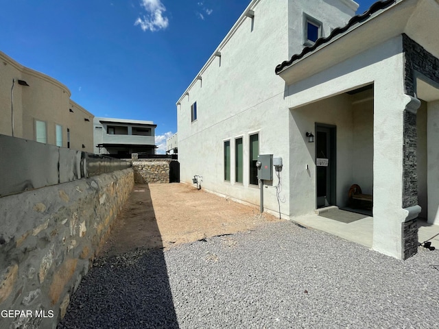 view of property exterior featuring a patio