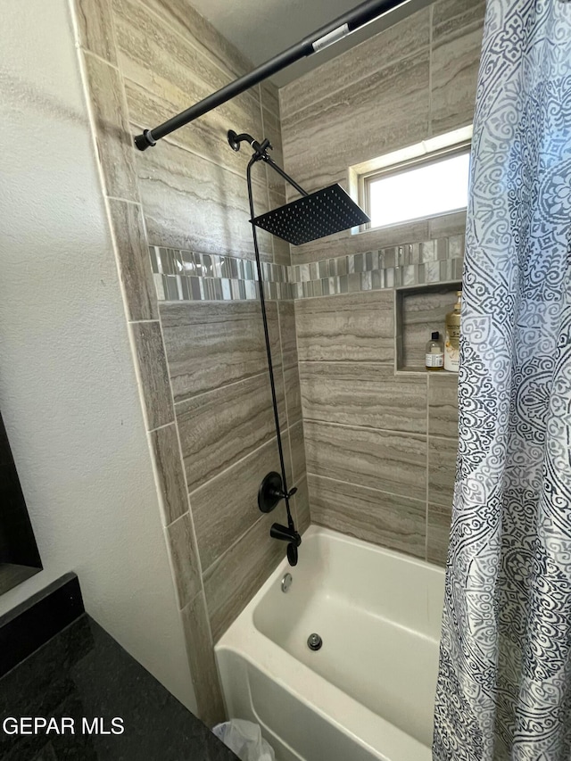 bathroom with shower / bath combination with curtain