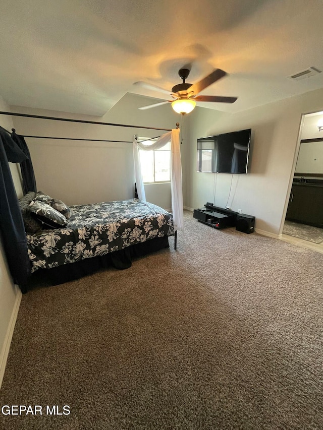 bedroom with lofted ceiling, carpet, and ceiling fan