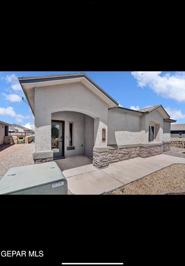 view of front of home with a patio area