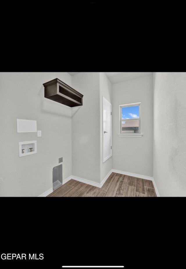 interior space featuring hardwood / wood-style flooring and washer hookup