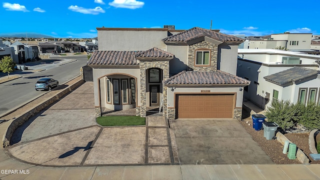 mediterranean / spanish-style house featuring a garage